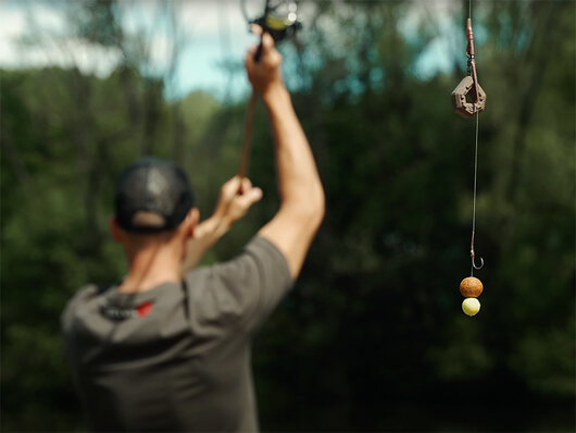 Olovená záťaž Delphin CyberBARBED Otvor